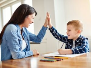 Tutor and student smiling during lesson