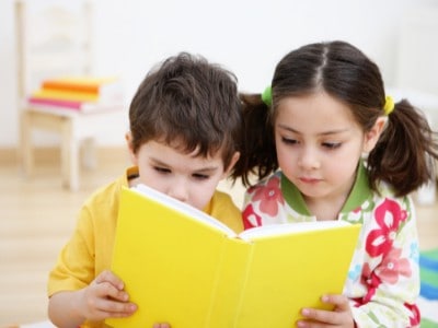 A boy and a girl read book