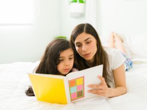 Mother and daughter read book