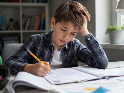 student-with-learning-disabilities A student with learning disabilities struggles with homework tasks.