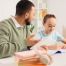 Adult helping a child with schoolwork at a table, illustrating individualized learning support for neurodivergent students and children with learning differences or learning disabilities.